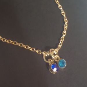 Gold necklace with blue gemstones